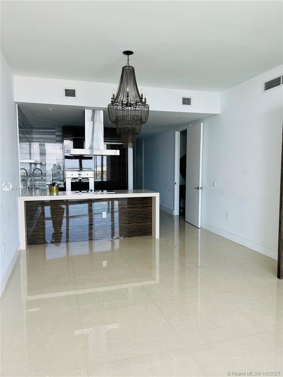 1100 Biscayne Boulevard, Unit 4504 Miami, FL 33132 - Photo 6 of 21 a kitchen with stainless steel appliances a sink and a stove
