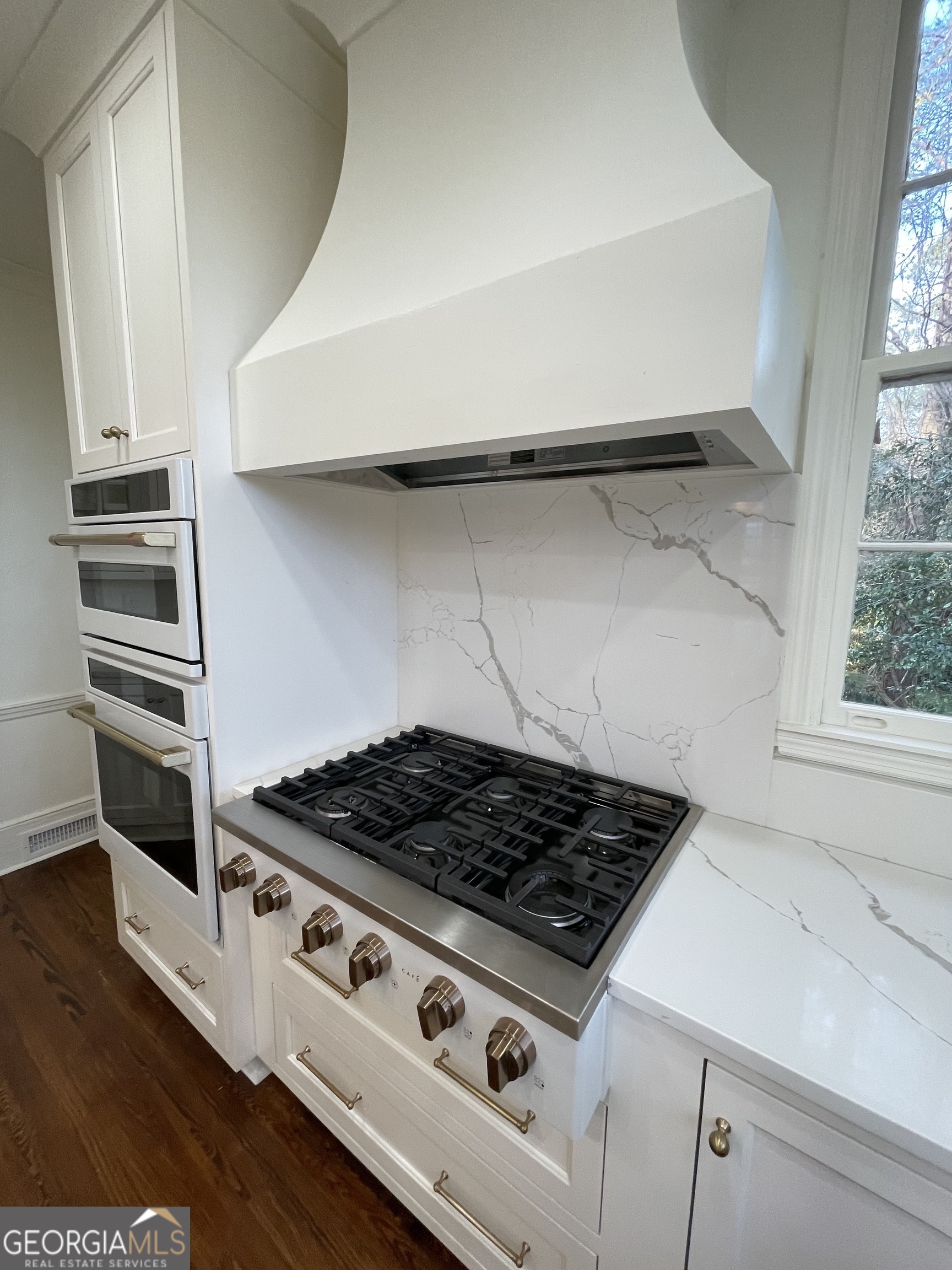 408 Thurston Avenue Thomaston, GA 30286 - Photo 19 of 51 a white stove top oven sitting inside of a kitchen