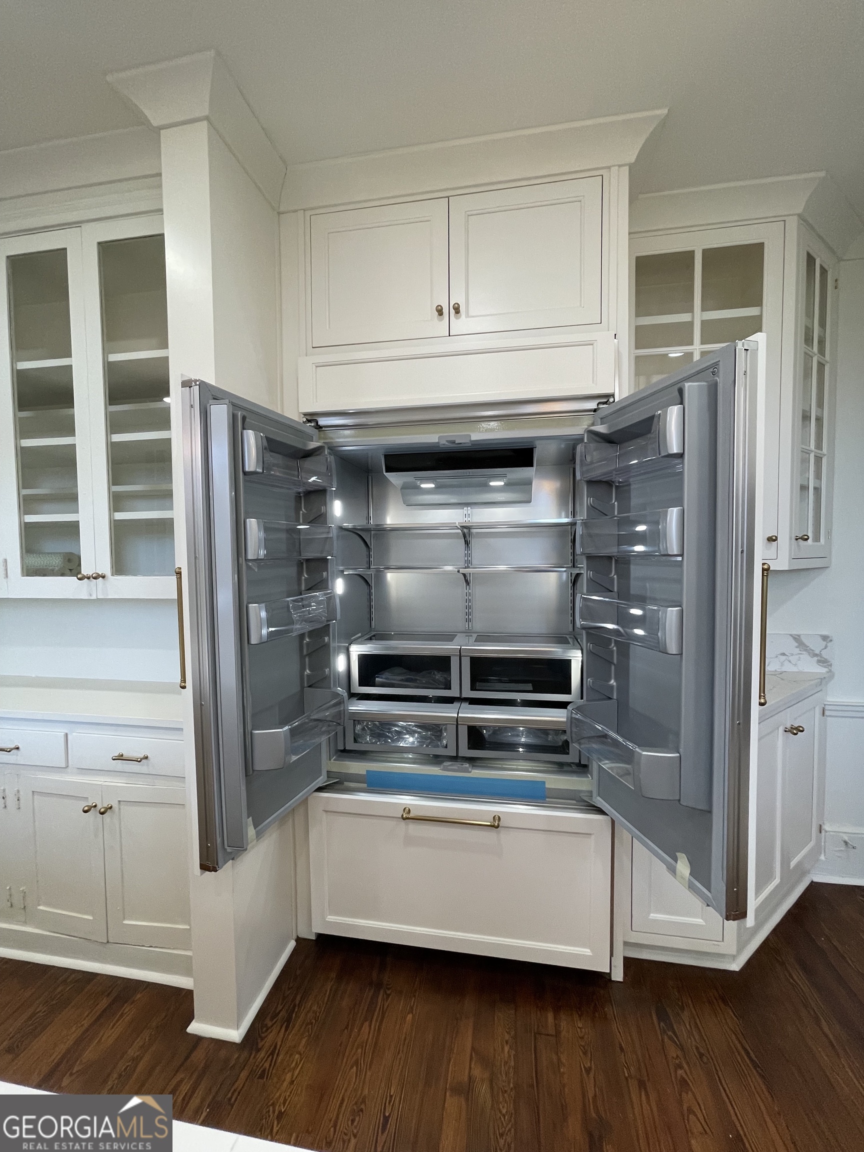 408 Thurston Avenue Thomaston, GA 30286 - Photo 21 of 51 a kitchen with stainless steel appliances and white cabinets