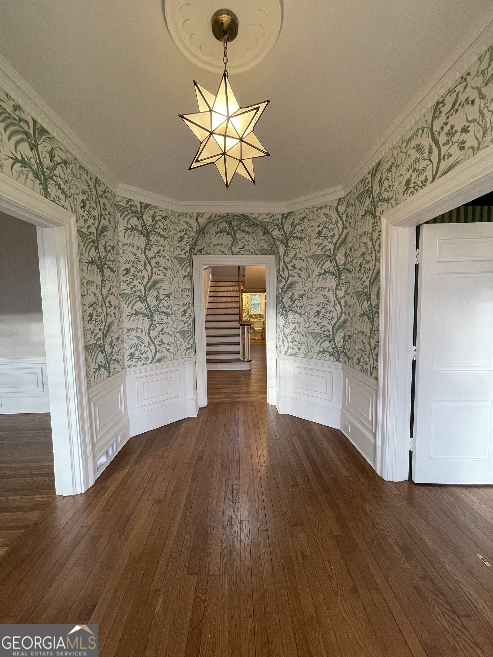 408 Thurston Avenue Thomaston, GA 30286 - Photo 3 of 51 wooden floor in an empty room with a window