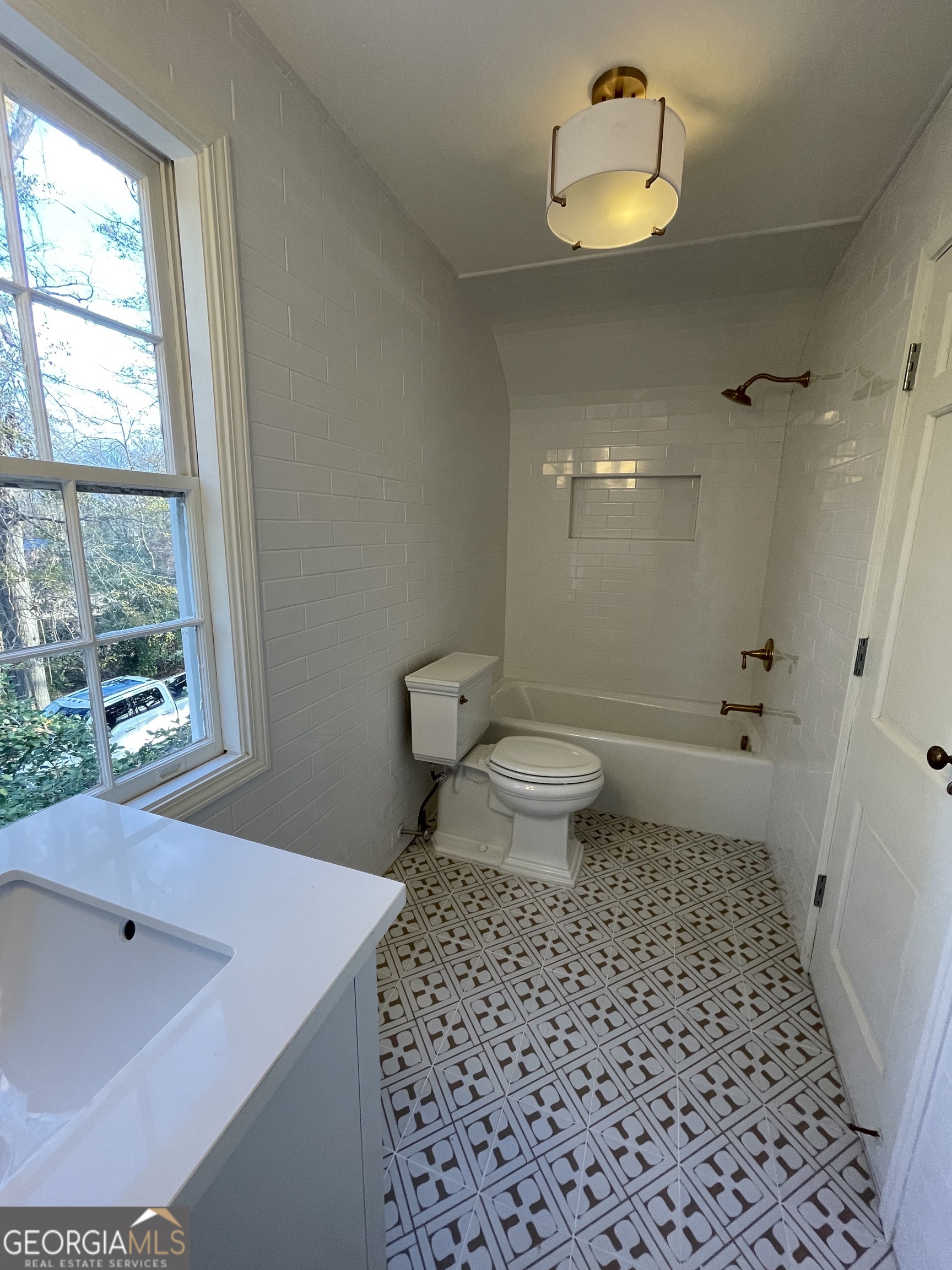 408 Thurston Avenue Thomaston, GA 30286 - Photo 34 of 51 a bathroom with a sink a toilet and shower