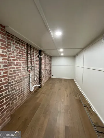 a front view of house with a garden