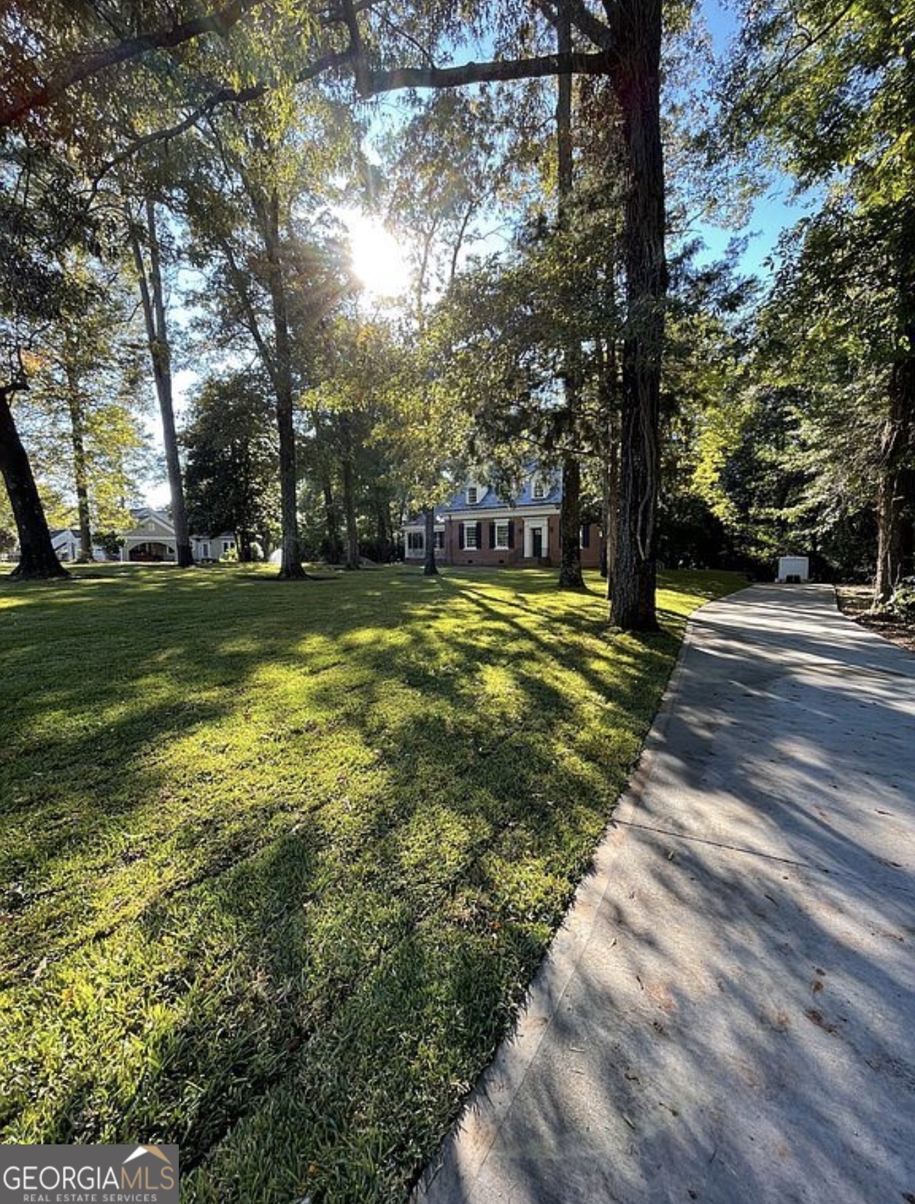 408 Thurston Avenue Thomaston, GA 30286 - Photo 49 of 51 a view of a yard with a tree