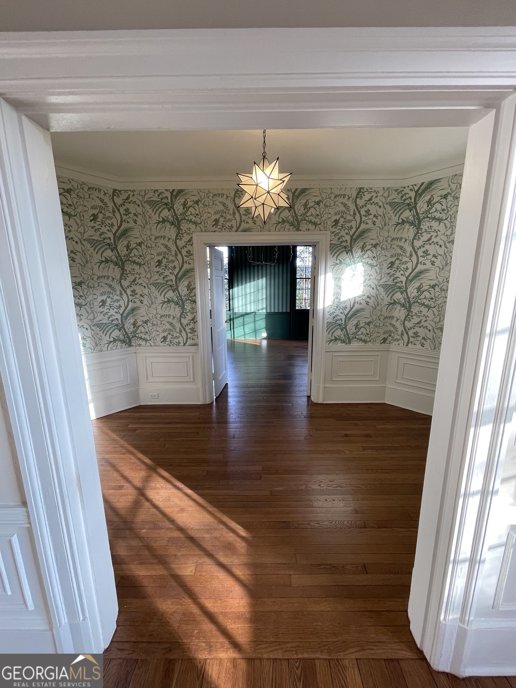 408 Thurston Avenue Thomaston, GA 30286 - Photo 5 of 51 a view of a hallway with a chandelier