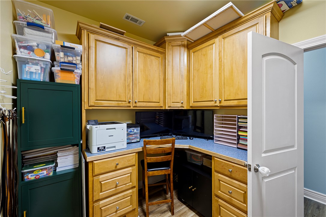 751 Walthall Road Russellville, AR 72802 - Photo 24 of 60 Dedicated workspace featuring extensive cabinetry with light wood-finish doors and a blue countertop