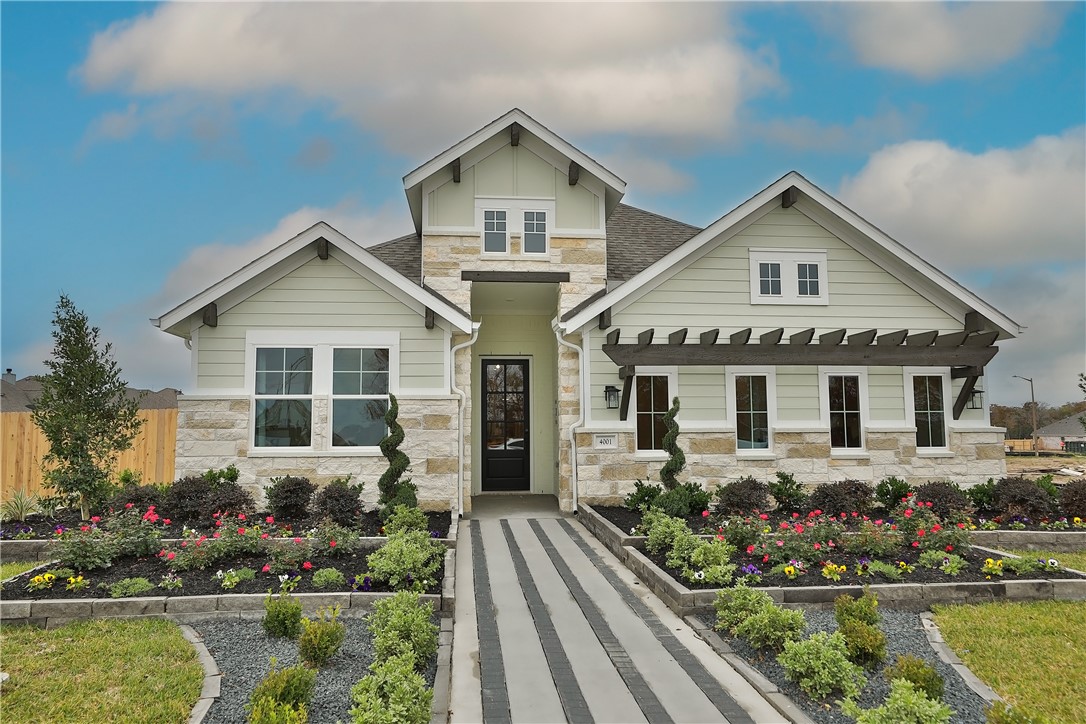 4001 Houberry Loop College Station, TX 77845 - Photo 1 of 1 Craftsman-style home with fence, stone siding, and