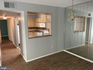 25 South Church Road, Unit 172 Maple Shade, NJ 08052 - Photo 2 of 7 an empty room with wooden floor and windows