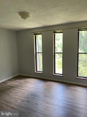 25 South Church Road, Unit 172 Maple Shade, NJ 08052 - Photo 4 of 7 an empty room with wooden floor and windows