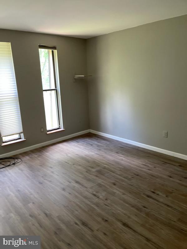 25 South Church Road, Unit 172 Maple Shade, NJ 08052 - Photo 5 of 7 an empty room with wooden floor and windows