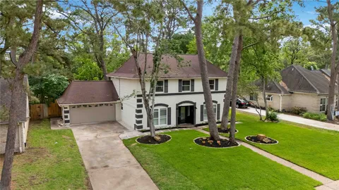 aerial view of a house with swimming pool garden and patio