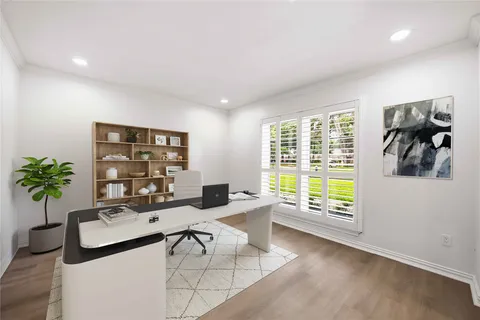 a living room with furniture and floor to ceiling window