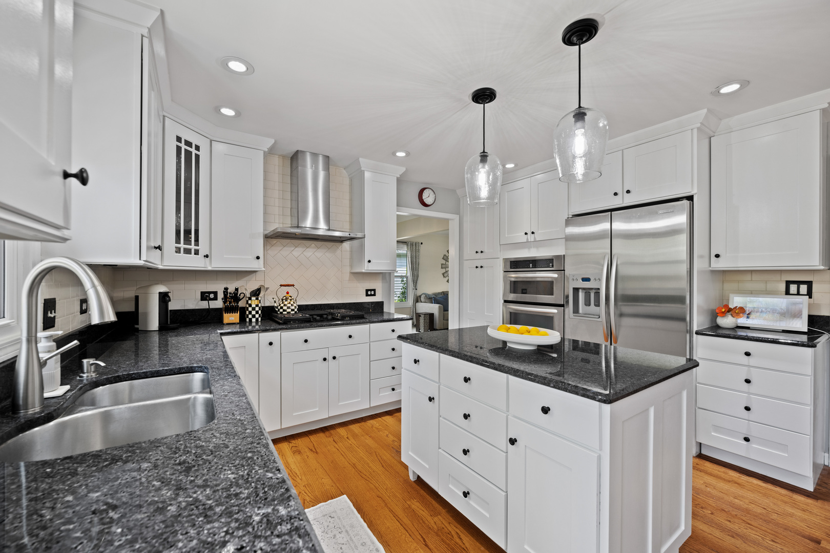1115 Fagan Road Batavia, IL 60510 - Photo 9 of 33 a kitchen with stainless steel appliances granite countertop a sink a stove a refrigerator and cabinets