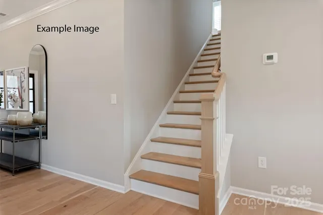 a view of entryway with wooden floor