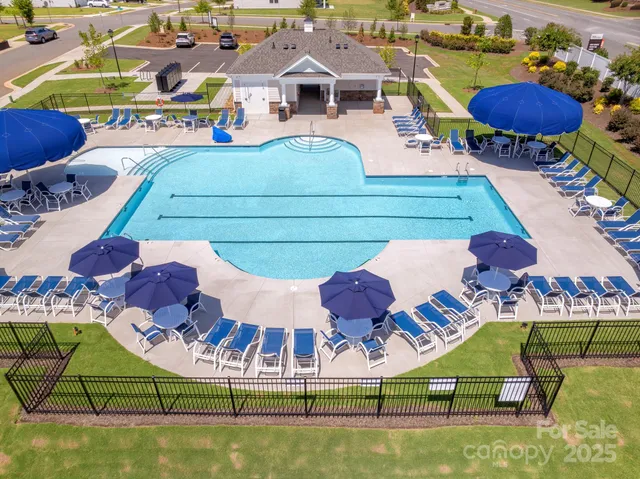 an aerial view of a chairs and table