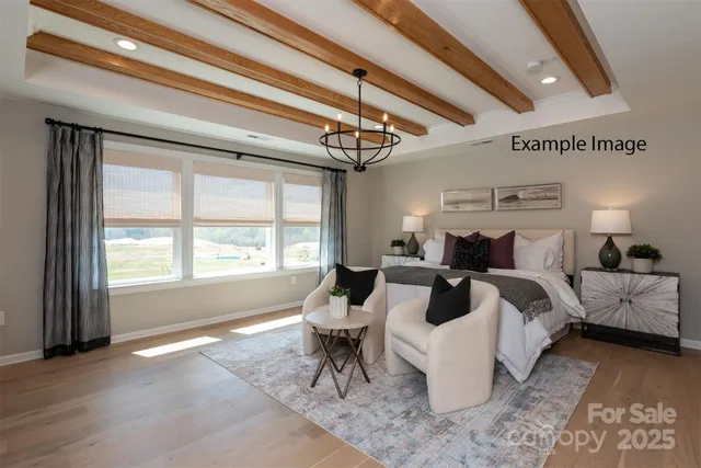 a bed room with a bed and a chair