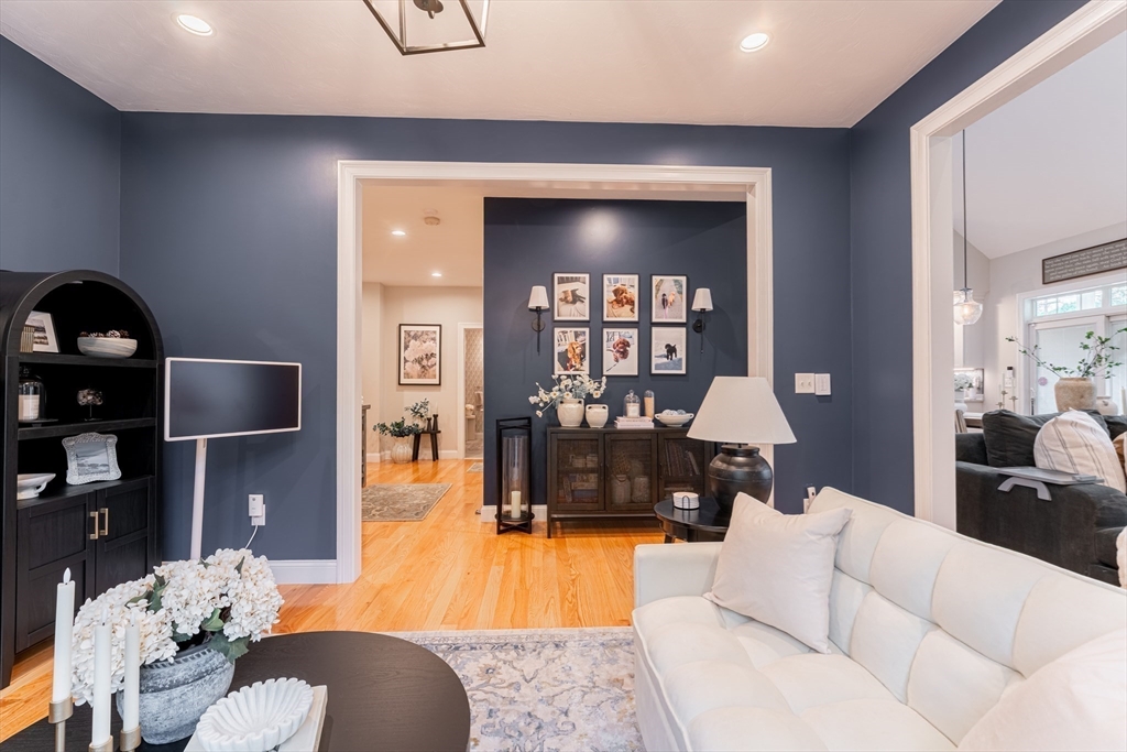 38 Cherry Street, Unit B Hudson, MA 01749 - Photo 14 of 33 a living room with furniture and a flat screen tv