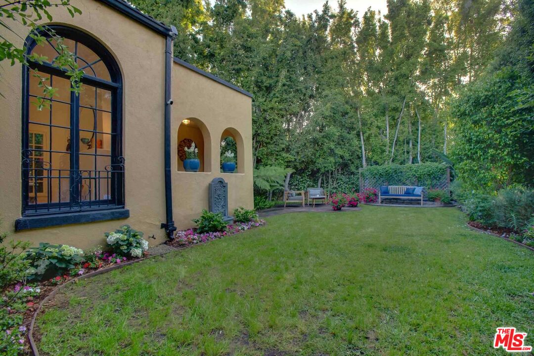 6354 Warner Drive Los Angeles, CA 90048 - Photo 19 of 43 a front view of a house with garden