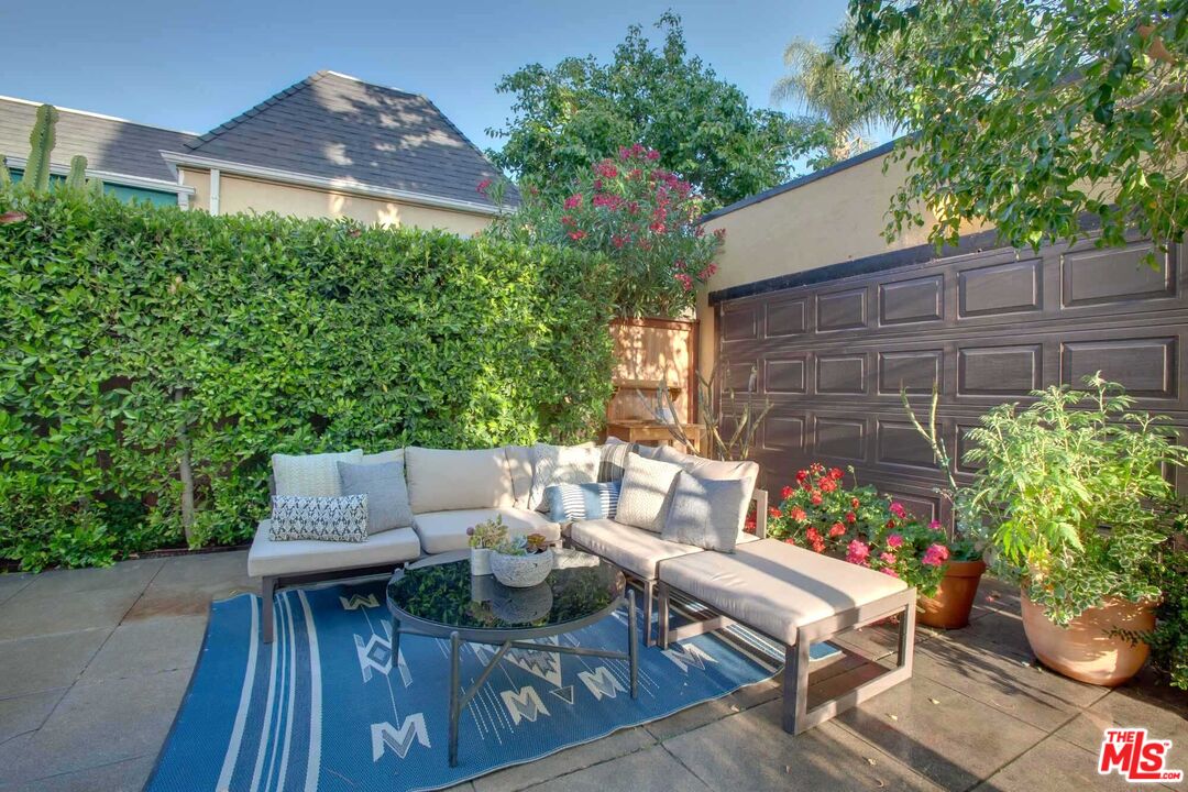 6354 Warner Drive Los Angeles, CA 90048 - Photo 32 of 43 a view of a chairs and table in backyard of the house