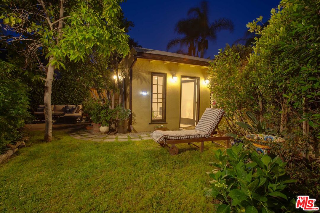 6354 Warner Drive Los Angeles, CA 90048 - Photo 35 of 43 a view of a house with a yard
