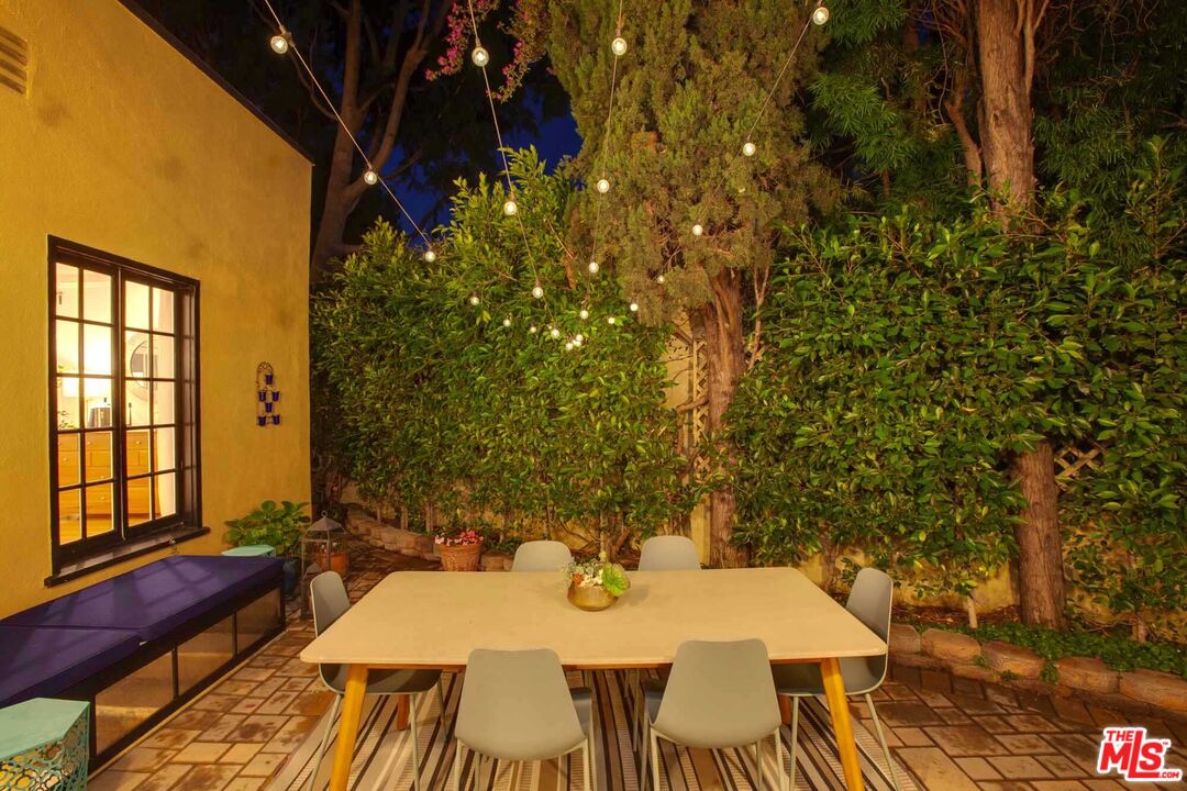6354 Warner Drive Los Angeles, CA 90048 - Photo 41 of 43 a view of a patio with table and chairs and potted plants