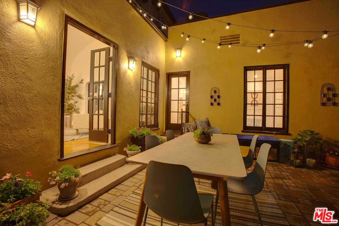 6354 Warner Drive Los Angeles, CA 90048 - Photo 42 of 43 a view of a dining room with furniture and wooden floor