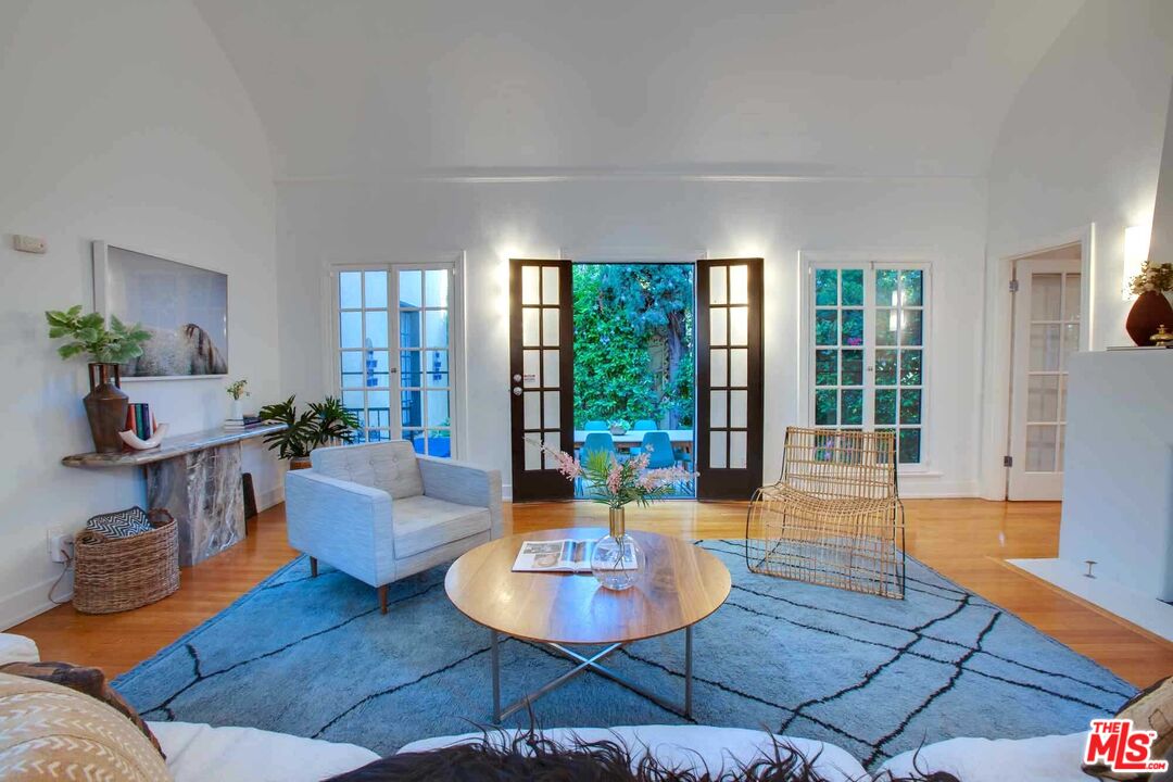 6354 Warner Drive Los Angeles, CA 90048 - Photo 6 of 43 a living room with furniture and a large window