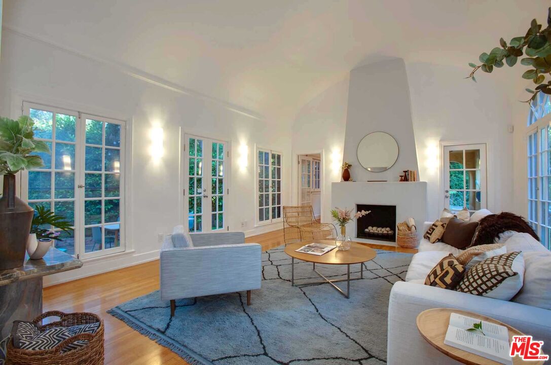 6354 Warner Drive Los Angeles, CA 90048 - Photo 7 of 43 a living room with furniture and a fireplace
