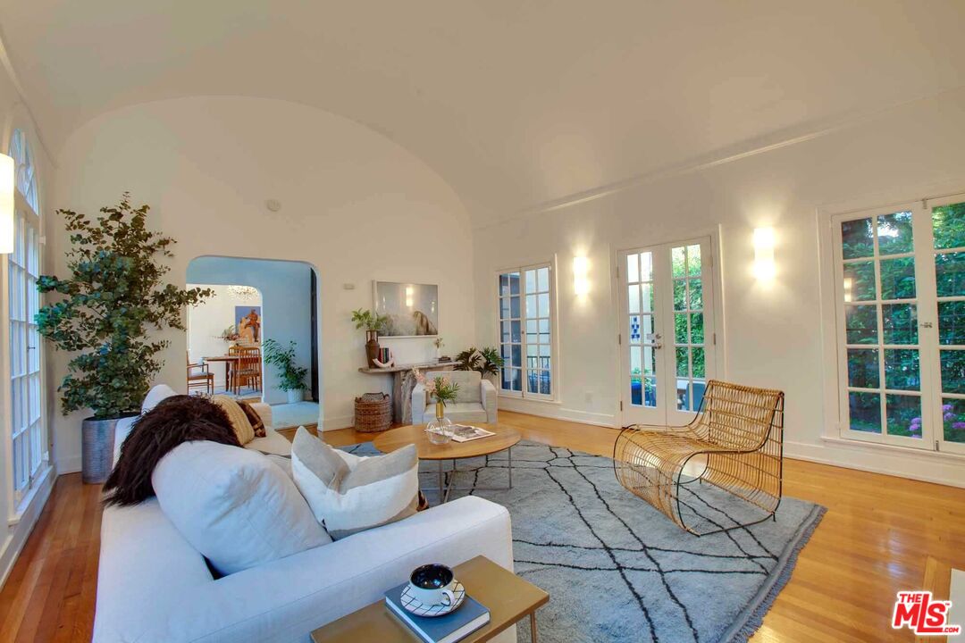 6354 Warner Drive Los Angeles, CA 90048 - Photo 8 of 43 a living room with furniture and a large window