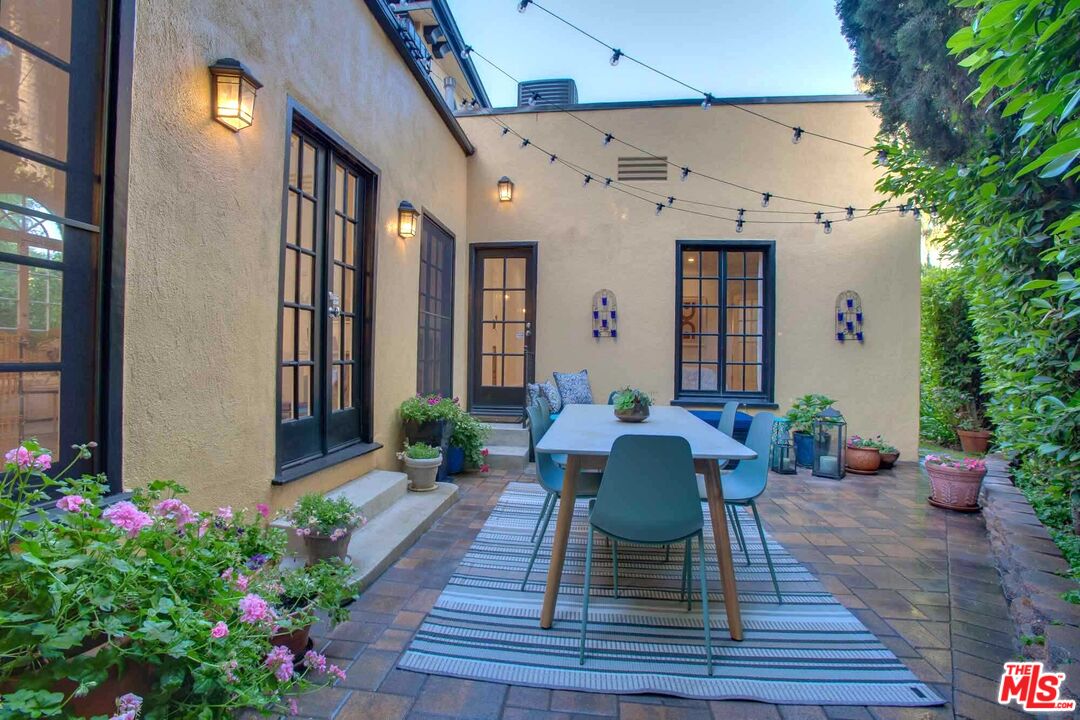 6354 Warner Drive Los Angeles, CA 90048 - Photo 10 of 43 a view of a house with patio outdoor seating and plants