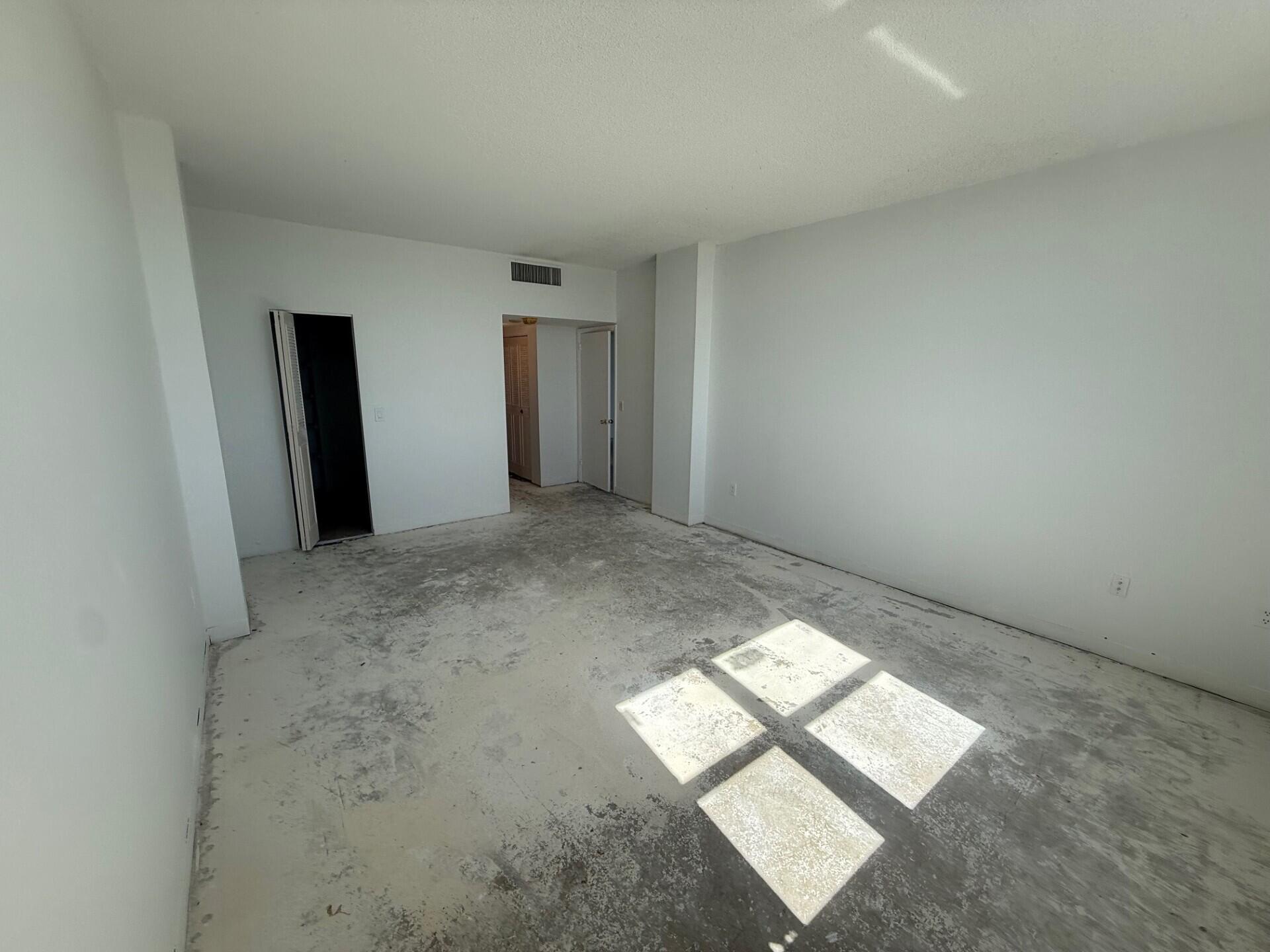 3450 South Ocean Boulevard, Unit 819 Palm Beach, FL 33480 - Photo 14 of 37 an empty room with windows