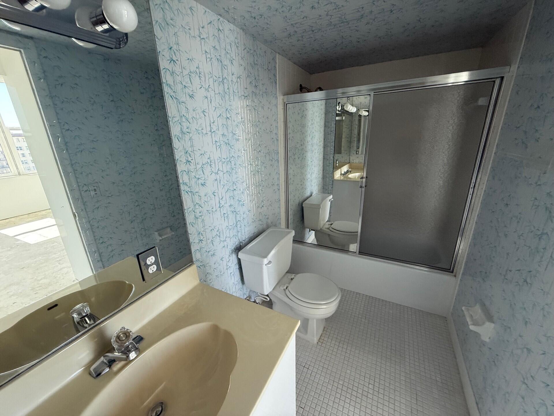 3450 South Ocean Boulevard, Unit 819 Palm Beach, FL 33480 - Photo 20 of 37 a bathroom with a sink toilet and shower