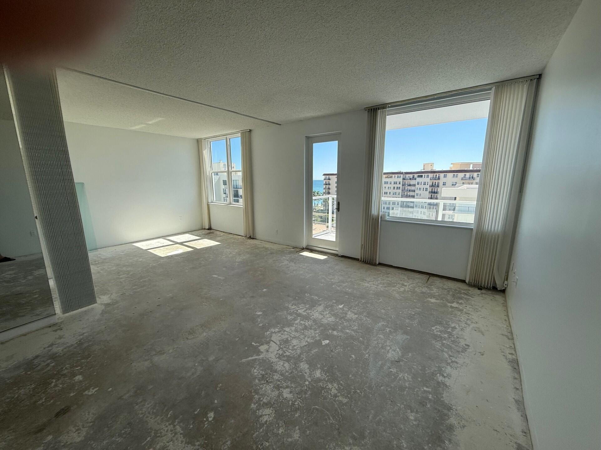3450 South Ocean Boulevard, Unit 819 Palm Beach, FL 33480 - Photo 9 of 37 a view of an empty room with a window