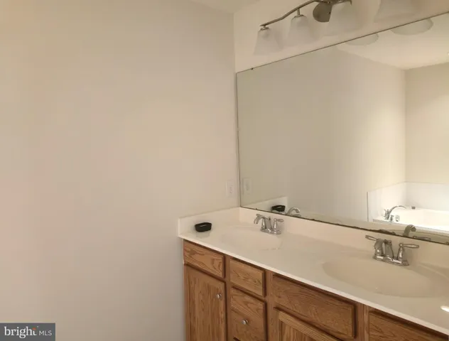a bathroom with a sink and vanity