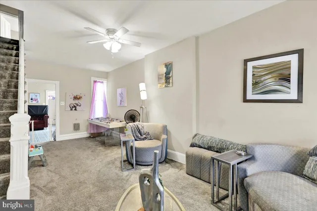 a living room with furniture and white walls