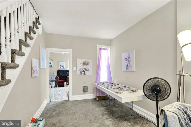 a view of a bedroom with furniture and staircase