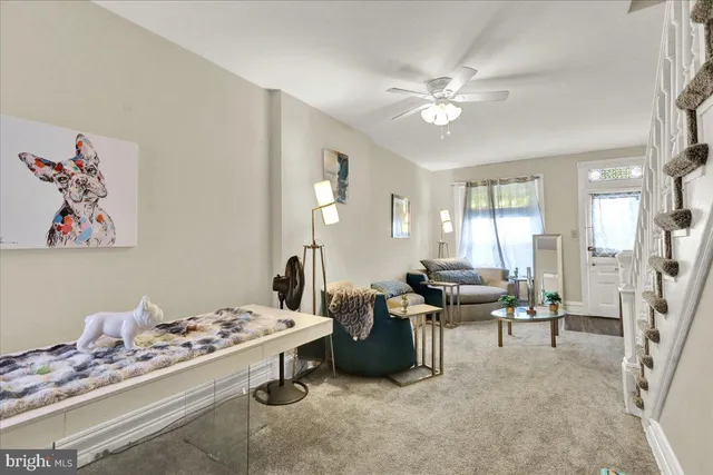 a living room with furniture and white walls