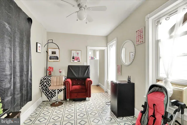 a bedroom with furniture and a window