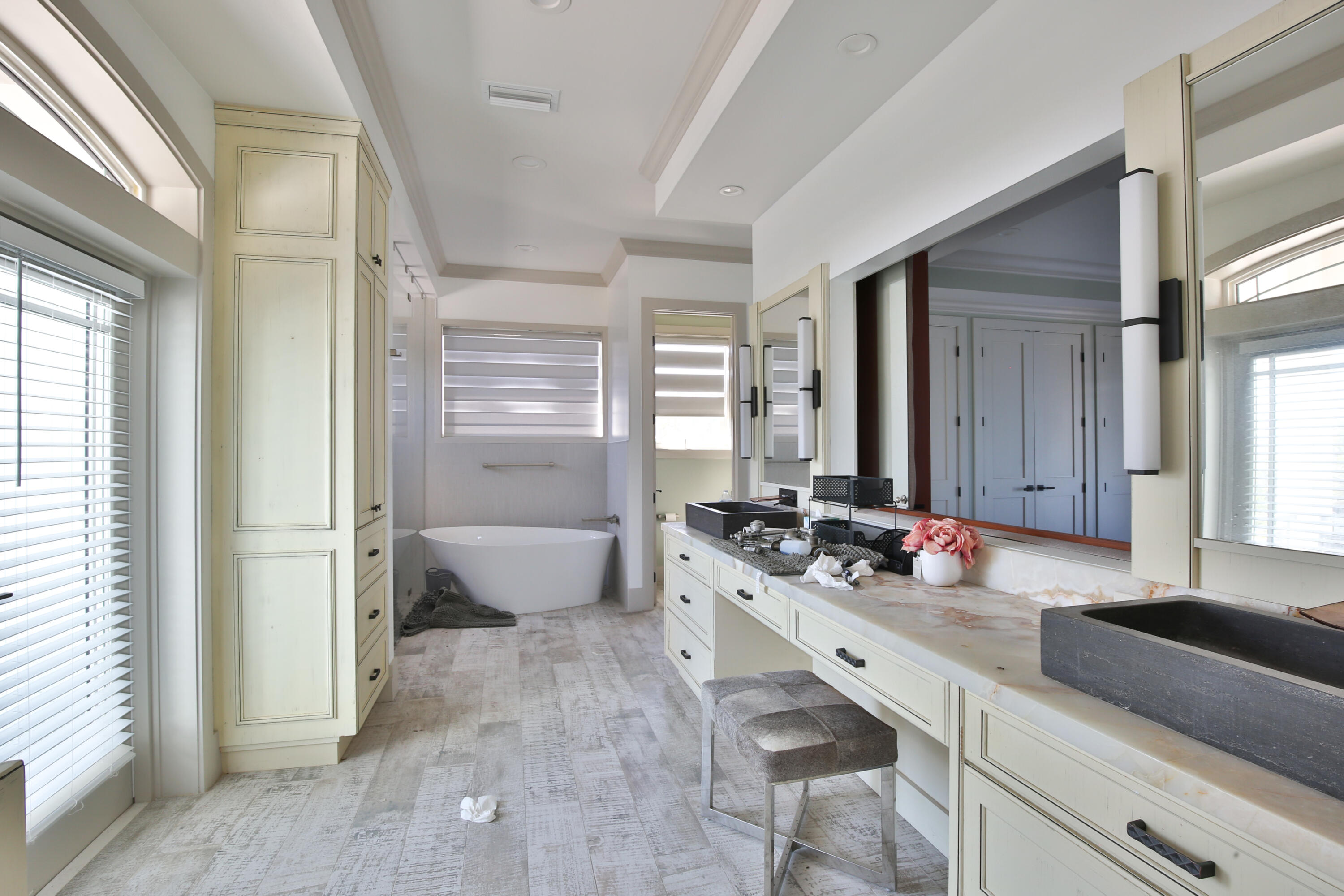 7816 Sanderling Road Sarasota, FL 34242 - Photo 16 of 34 a spacious bathroom with double vanity and a mirror