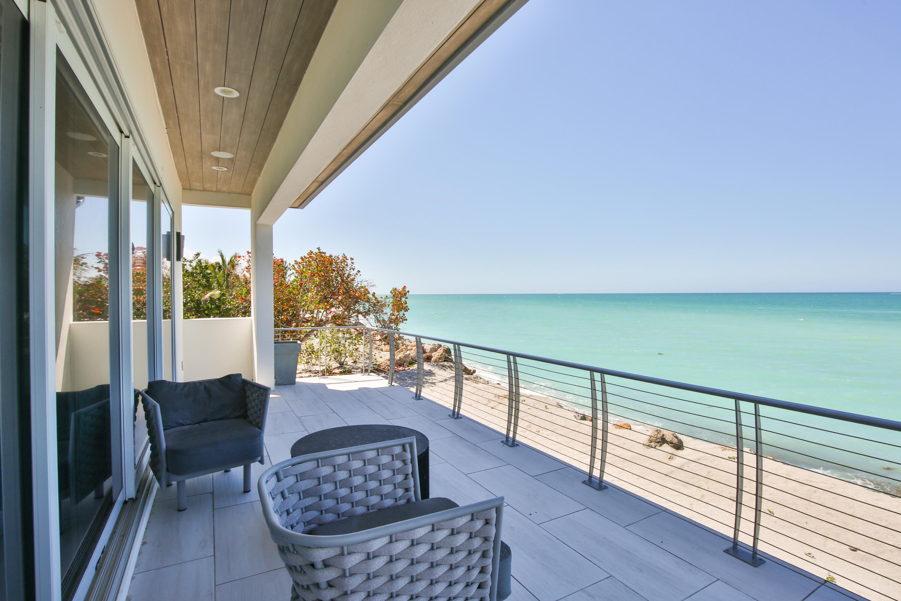 7816 Sanderling Road Sarasota, FL 34242 - Photo 18 of 34 a view of balcony with furniture