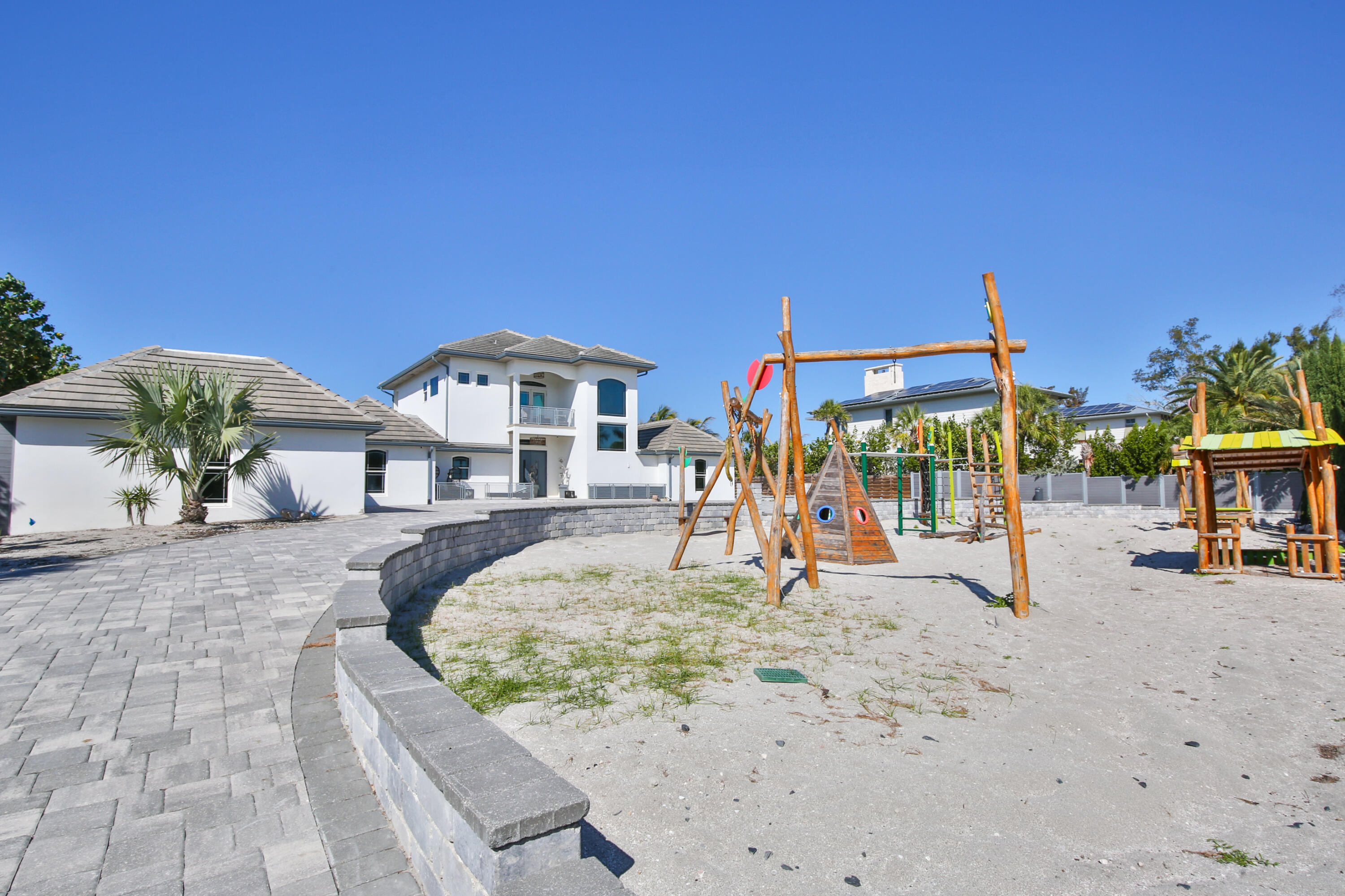 7816 Sanderling Road Sarasota, FL 34242 - Photo 20 of 34 a view of a swimming pool with a patio