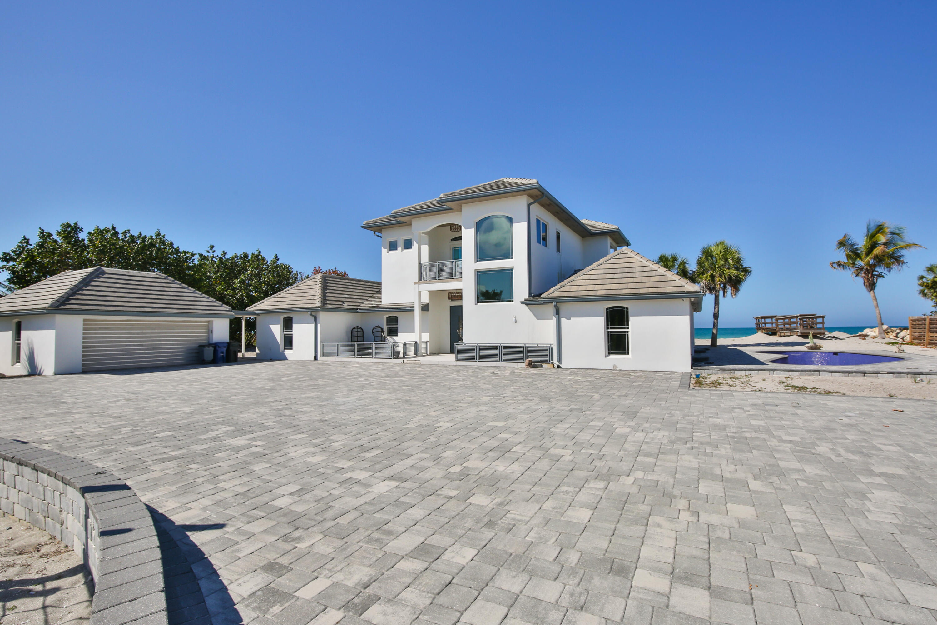 7816 Sanderling Road Sarasota, FL 34242 - Photo 2 of 34 a front view of a house with a yard