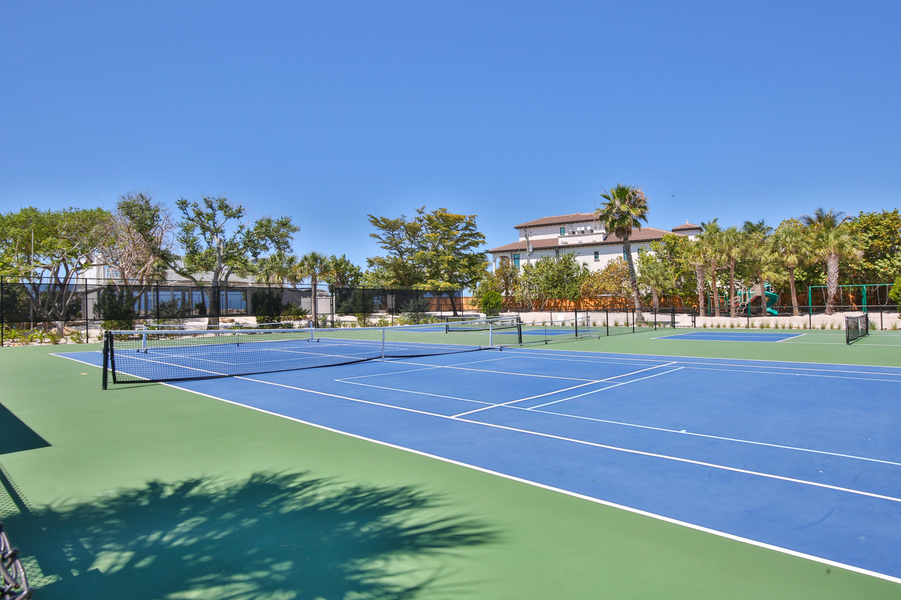 7816 Sanderling Road Sarasota, FL 34242 - Photo 25 of 34 a view of tennis court