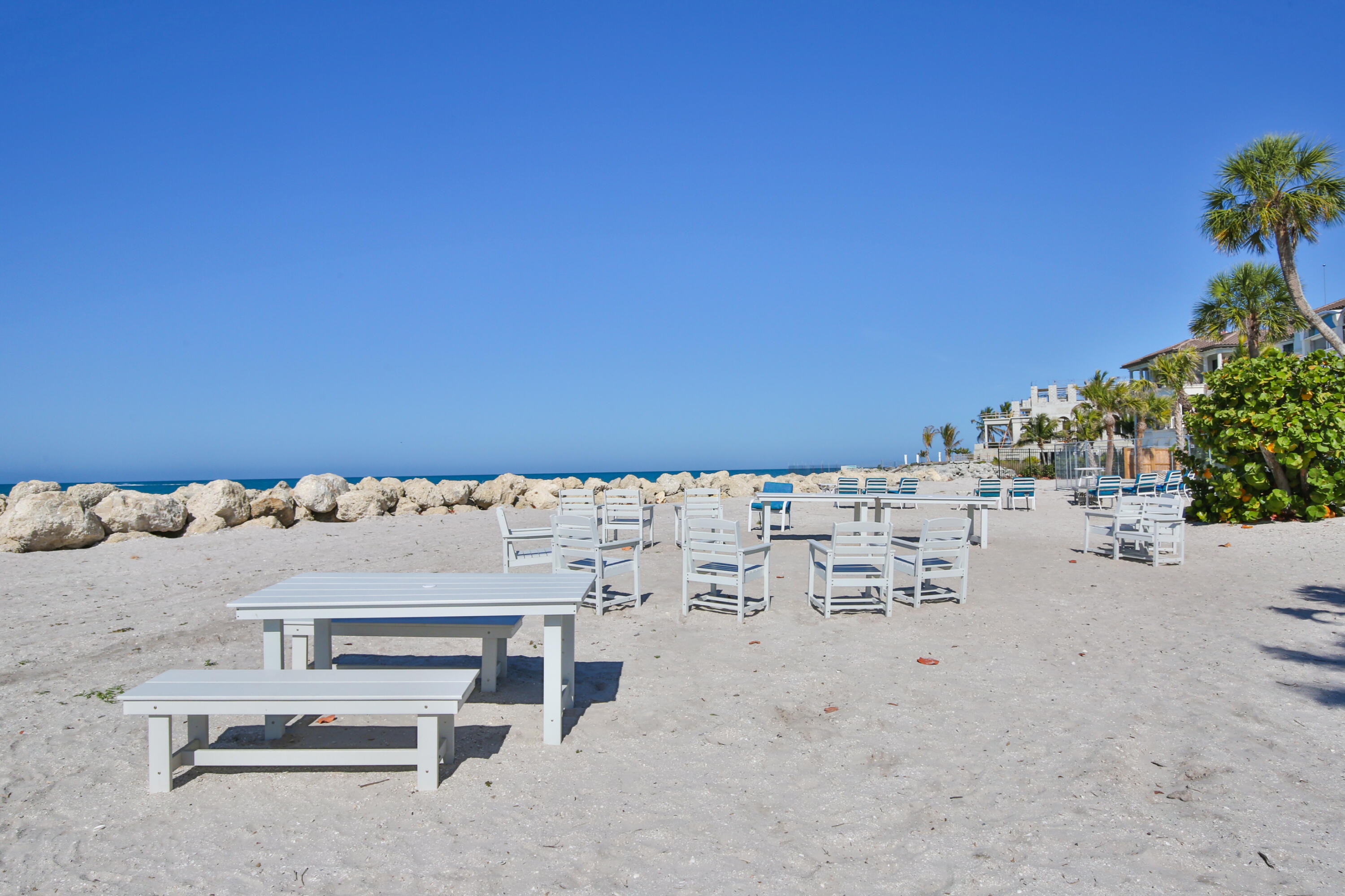 7816 Sanderling Road Sarasota, FL 34242 - Photo 28 of 34 a view of terrace with a bench