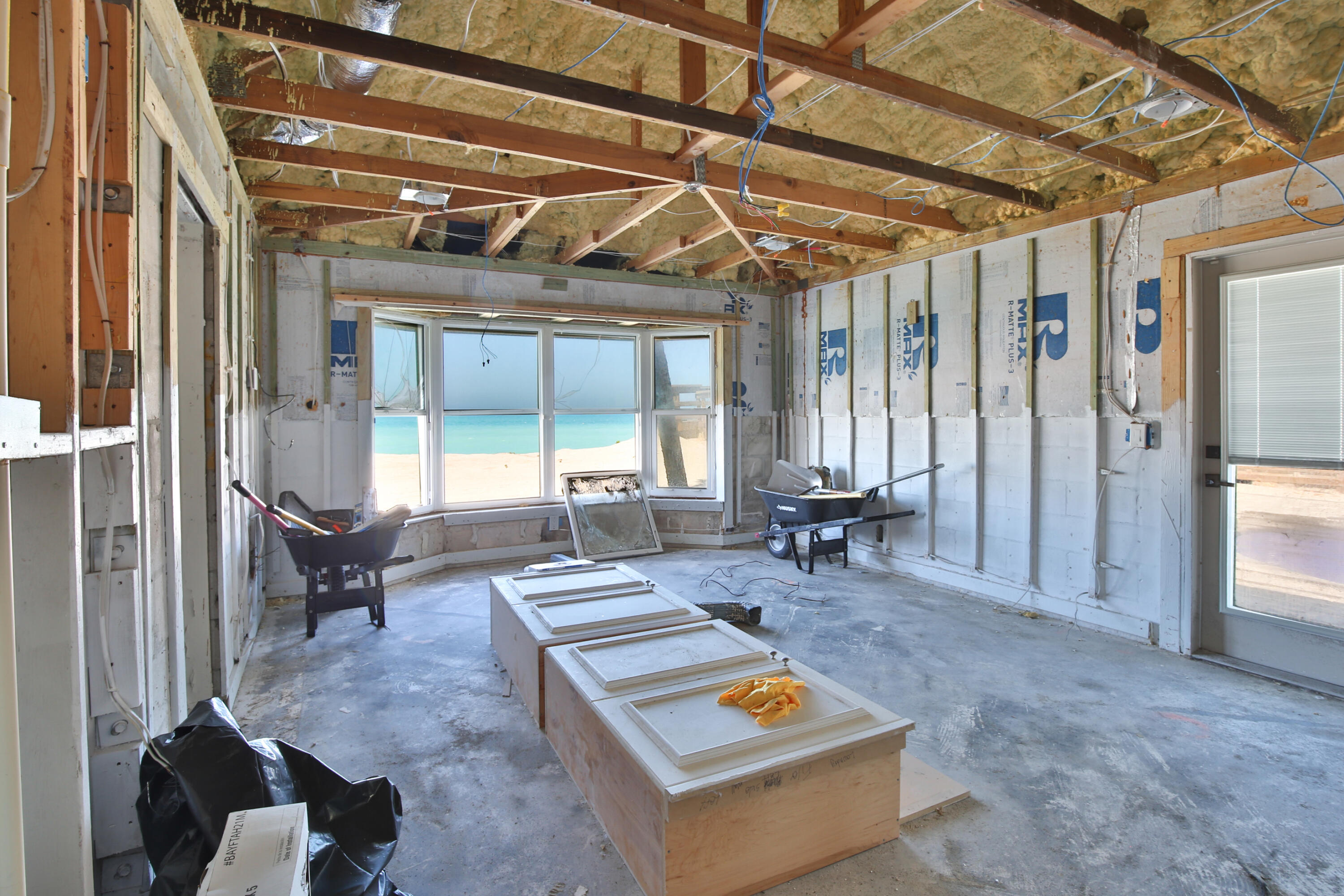 7816 Sanderling Road Sarasota, FL 34242 - Photo 9 of 34 a living room with furniture and a table