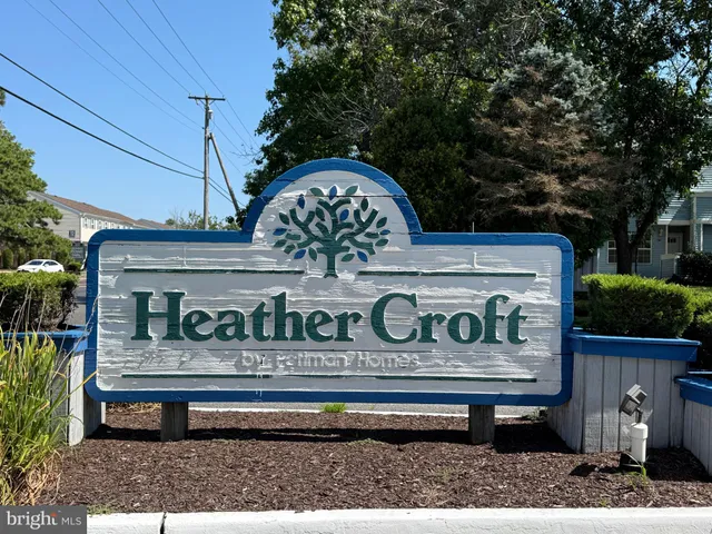 a view of a bench sitting in front of a building