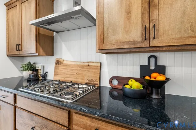 a kitchen with a stove and cabinets