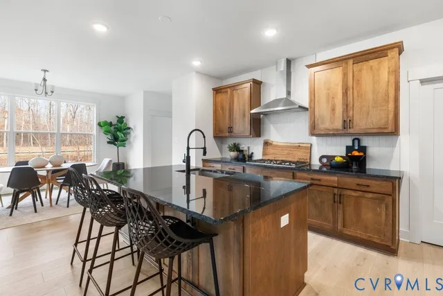 a kitchen with cabinets a sink and appliances