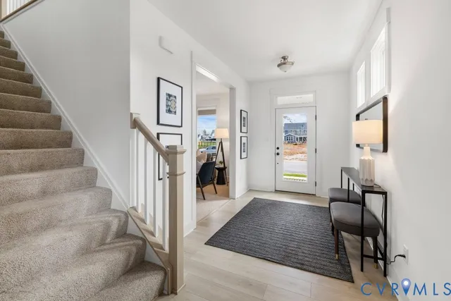 a view of a hallway view with staircase