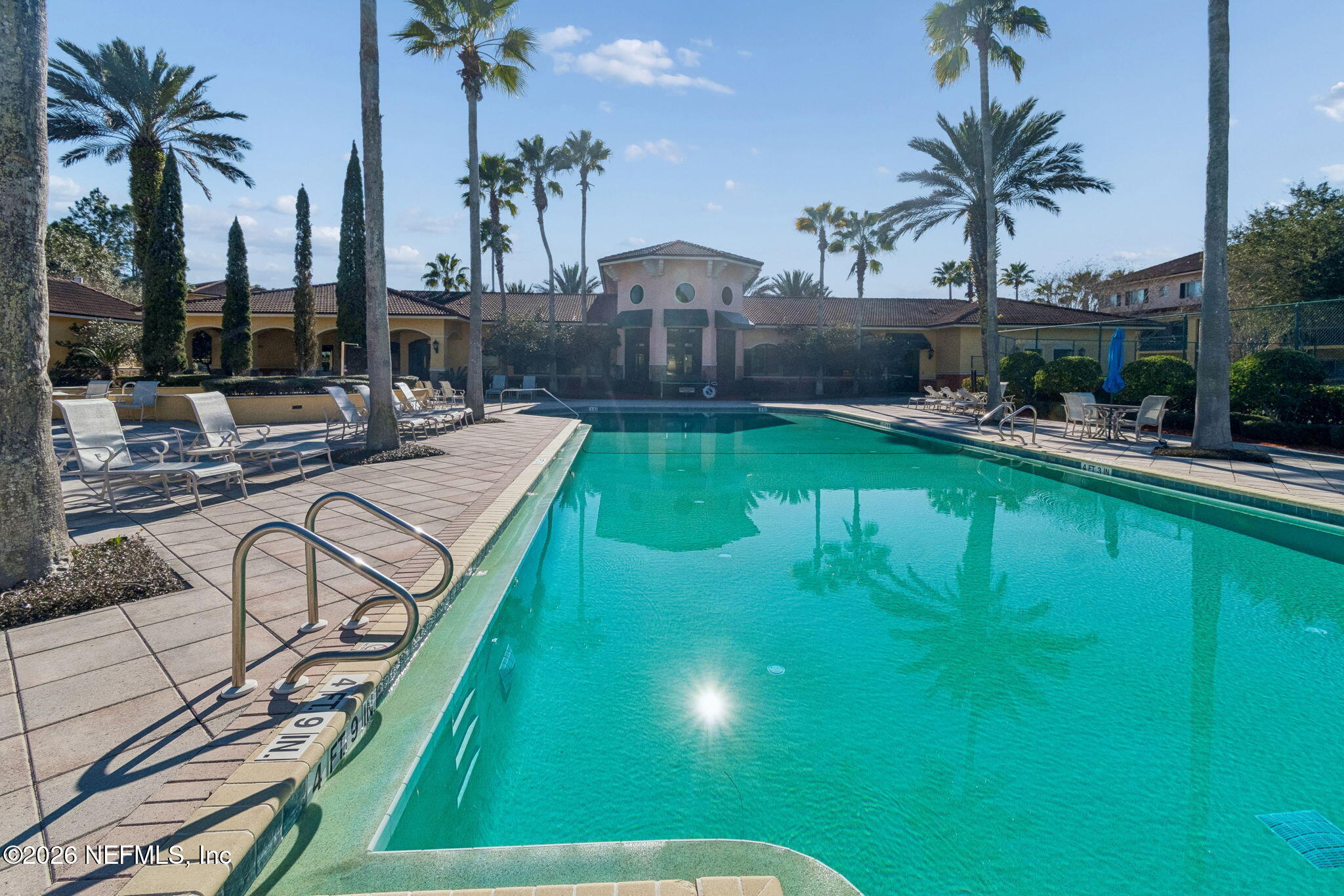 9745 Touchton Road, Unit 2903 Jacksonville, FL 32246 - Photo 115 of 155 a view of a swimming pool with a patio and a garden