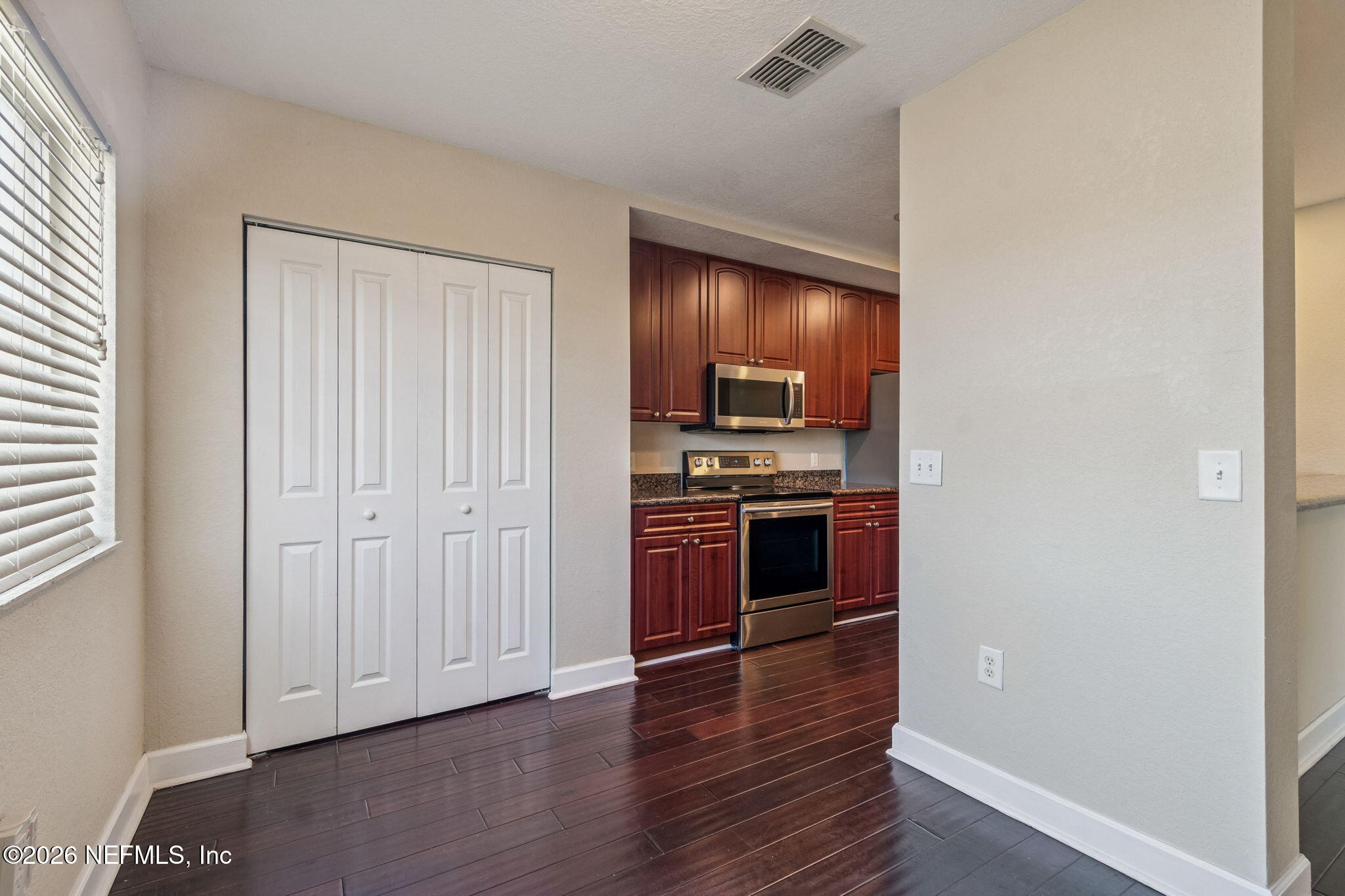 9745 Touchton Road, Unit 2903 Jacksonville, FL 32246 - Photo 33 of 155 a kitchen with stainless steel appliances a stove and a refrigerator